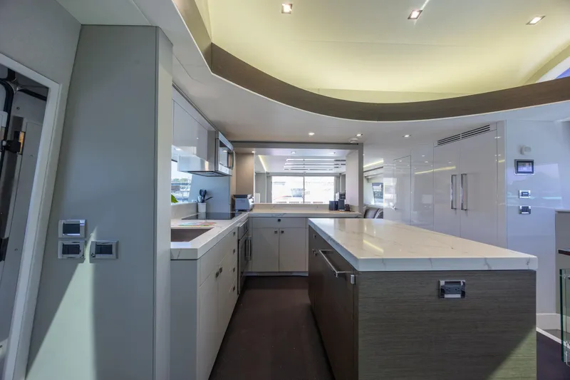 Slide: The Image of Luxurious kitchen interior of 2017 Hatteras M75 Panacera yacht with modern design and sleek finishes. - 50