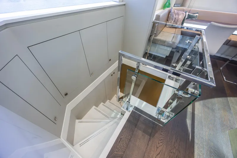 Slide: The Image of Staircase with glass railing on 2017 Hatteras M75 Panacera yacht interior. - 53