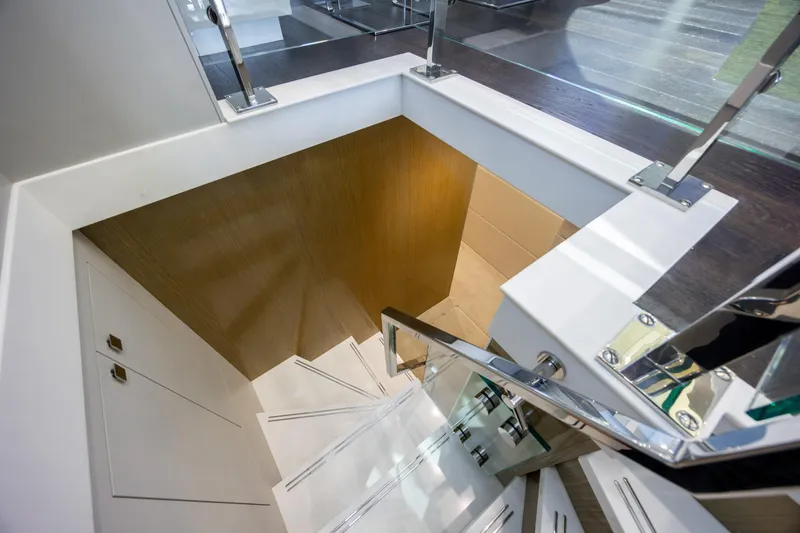 Slide: The Image of Staircase on 2017 Hatteras M75 Panacera yacht with modern design and glass railing. - 55