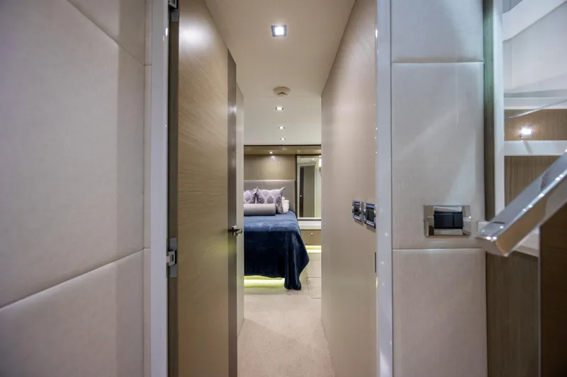 Slide: The Image of Luxurious bedroom interior of 2017 Hatteras M75 Panacera yacht, featuring modern design and cozy ambiance. - 57