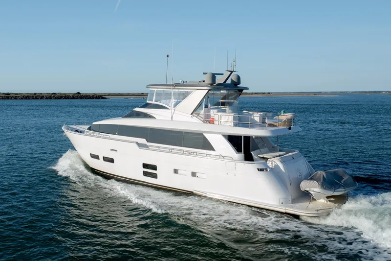 Slide: The Image of Luxury 2017 Hatteras M75 Panacera yacht cruising on open water. - 6