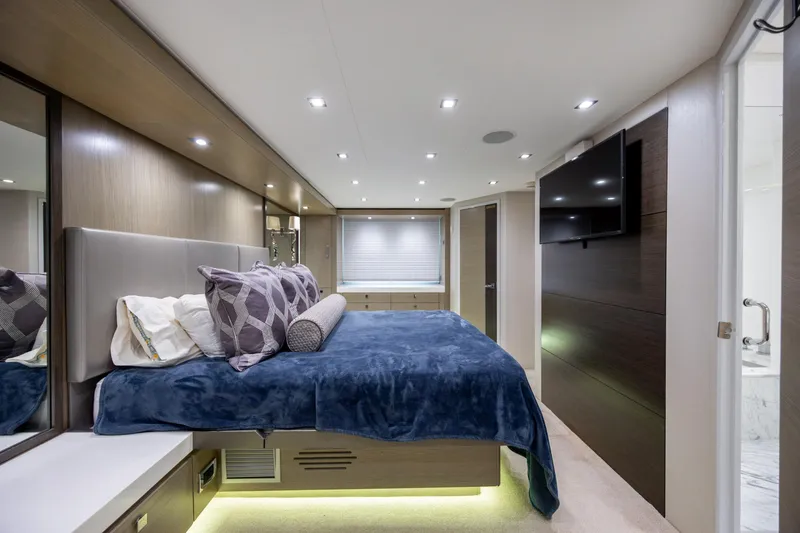 Slide: The Image of Luxurious bedroom interior of 2017 Hatteras M75 Panacera yacht with modern decor and ambient lighting. - 60