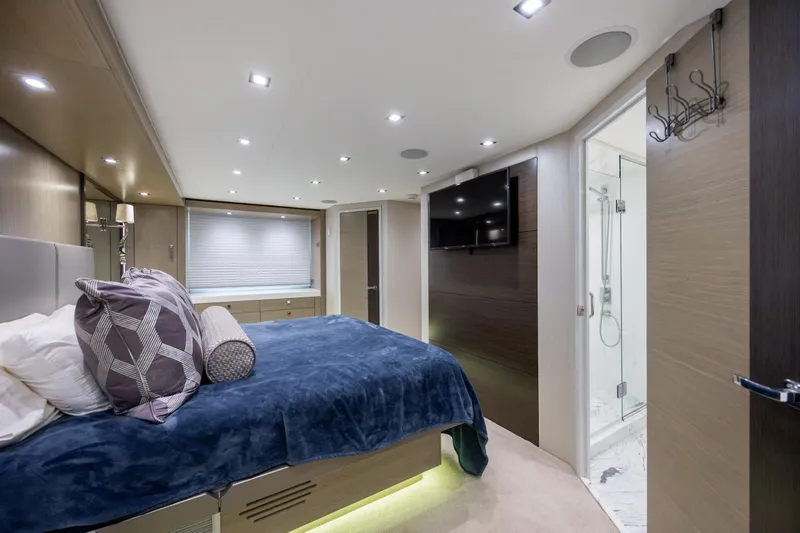 Slide: The Image of Luxurious bedroom interior of 2017 Hatteras M75 Panacera yacht with modern decor and ensuite bathroom. - 61