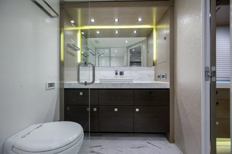 Slide: The Image of Luxurious bathroom in 2017 Hatteras M75 Panacera yacht with modern fixtures and elegant design. - 65