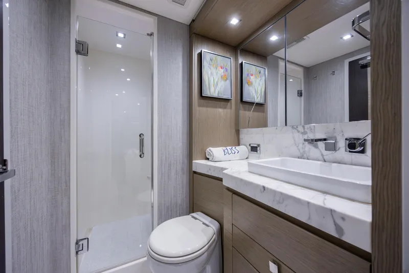 Slide: The Image of Luxurious bathroom in 2017 Hatteras M75 Panacera yacht with modern fixtures and elegant design. - 70