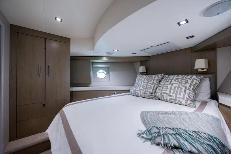 Slide: The Image of Luxurious bedroom interior of 2017 Hatteras M75 Panacera yacht with modern design elements. - 75