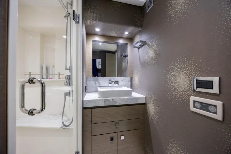 Slide: The Image of Luxurious bathroom interior of 2017 Hatteras M75 Panacera yacht with modern fixtures. - 77