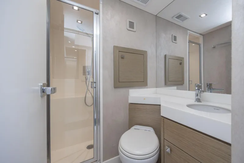 Slide: The Image of Luxurious bathroom in 2017 Hatteras M75 Panacera yacht with modern fixtures and shower. - 85