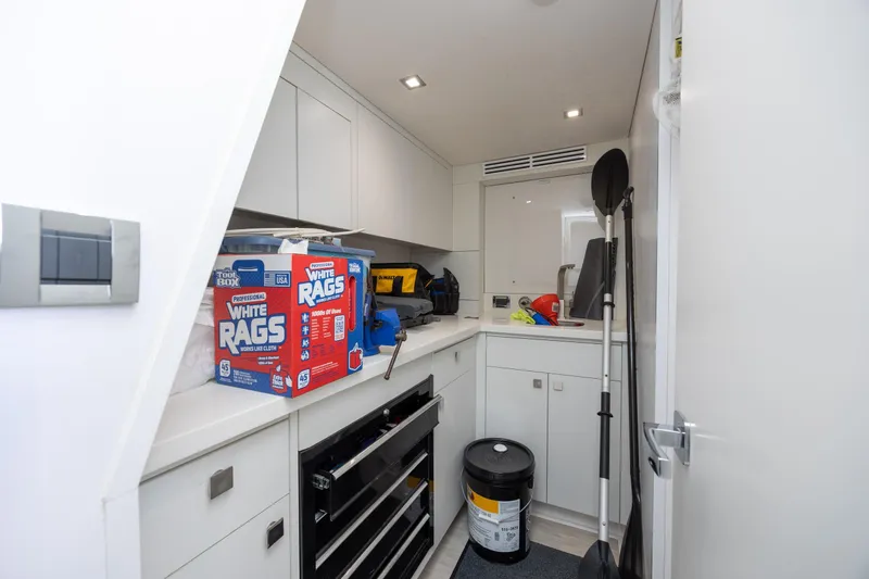 Slide: The Image of Utility room on 2017 Hatteras M75 Panacera yacht with cleaning supplies and tools. - 88