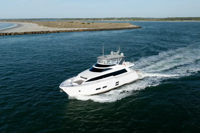 Slide: The Image of Luxury yacht Hatteras M75 Panacera 2017 cruising on open water near coastline. - 9