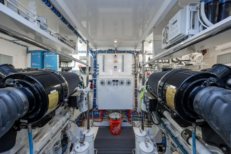 Slide: The Image of Engine room of 2017 Hatteras M75 Panacera yacht, featuring advanced machinery and equipment. - 92