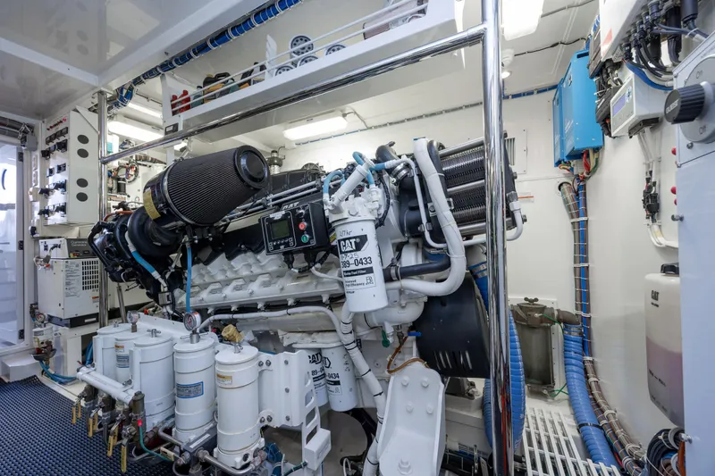 Slide: The Image of Engine room of 2017 Hatteras M75 Panacera yacht, featuring advanced machinery and equipment. - 94