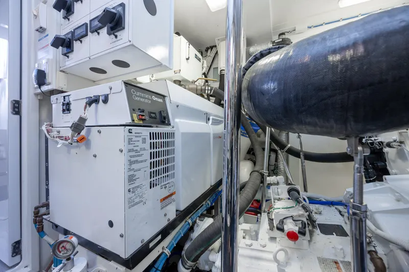 Slide: The Image of Engine room of 2017 Hatteras M75 Panacera yacht with Cummins Onan generator. - 97