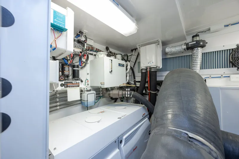 Slide: The Image of Engine room of 2017 Hatteras M75 Panacera yacht, showcasing mechanical systems and components. - 98