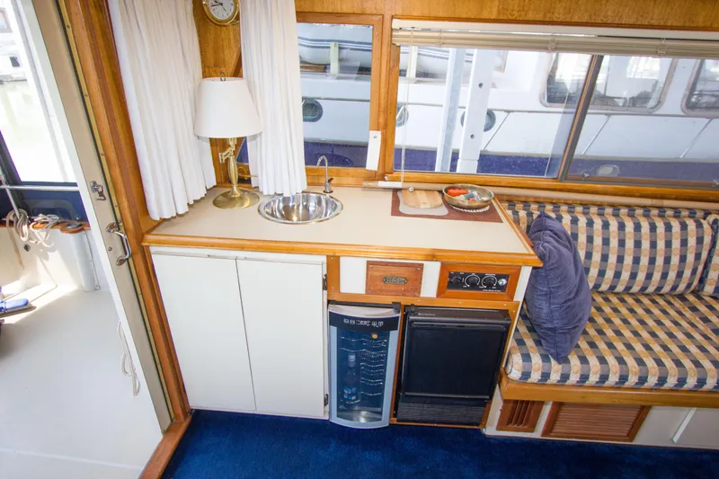 Slide: The Image of Interior of a 1984 Californian LRC yacht with kitchenette and seating area. - 11
