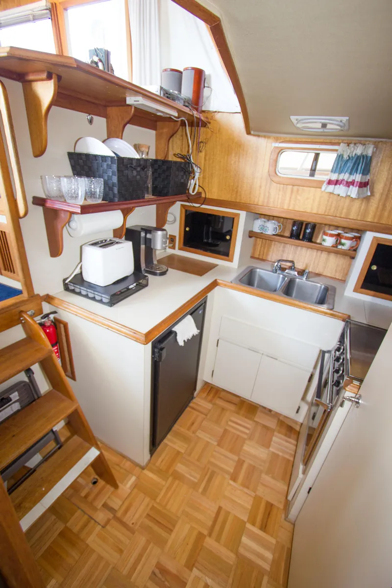 Slide: The Image of 1984 Californian LRC yacht kitchen area with wood paneling. - 13