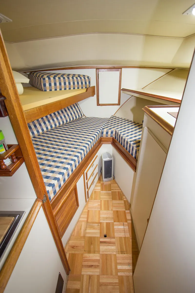 Slide: The Image of 1984 Californian LRC boat cabin with striped bedding. - 15