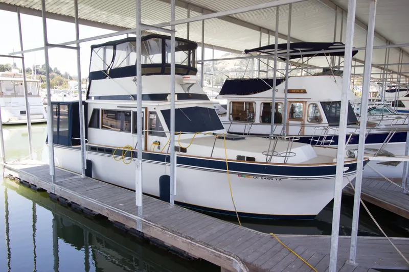 Slide: The Image of 1984 Californian LRC yacht docked in marina, side view. - 2