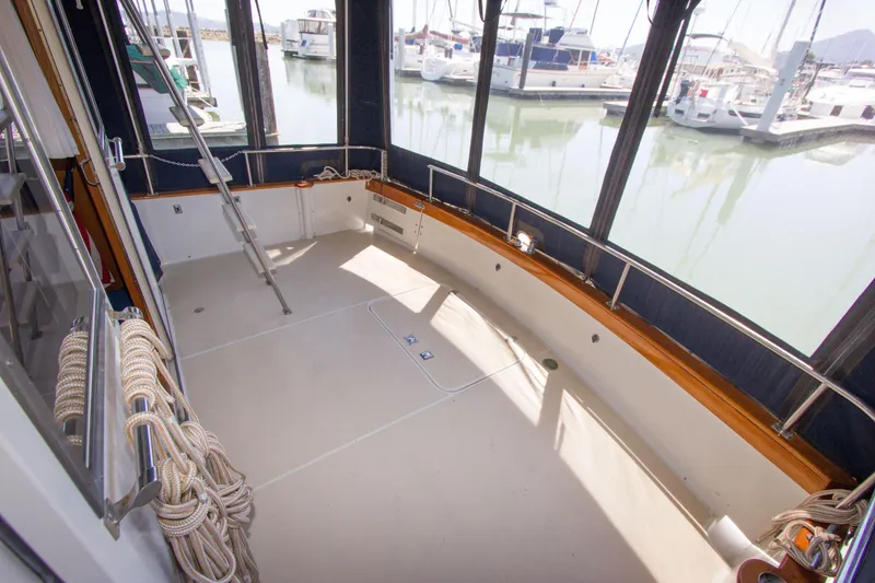 Slide: The Image of 1984 Californian LRC yacht with spacious deck area in marina. - 21