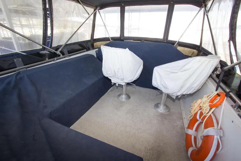 Slide: The Image of Interior of a 1984 Californian LRC boat with seating area and life preserver. - 23
