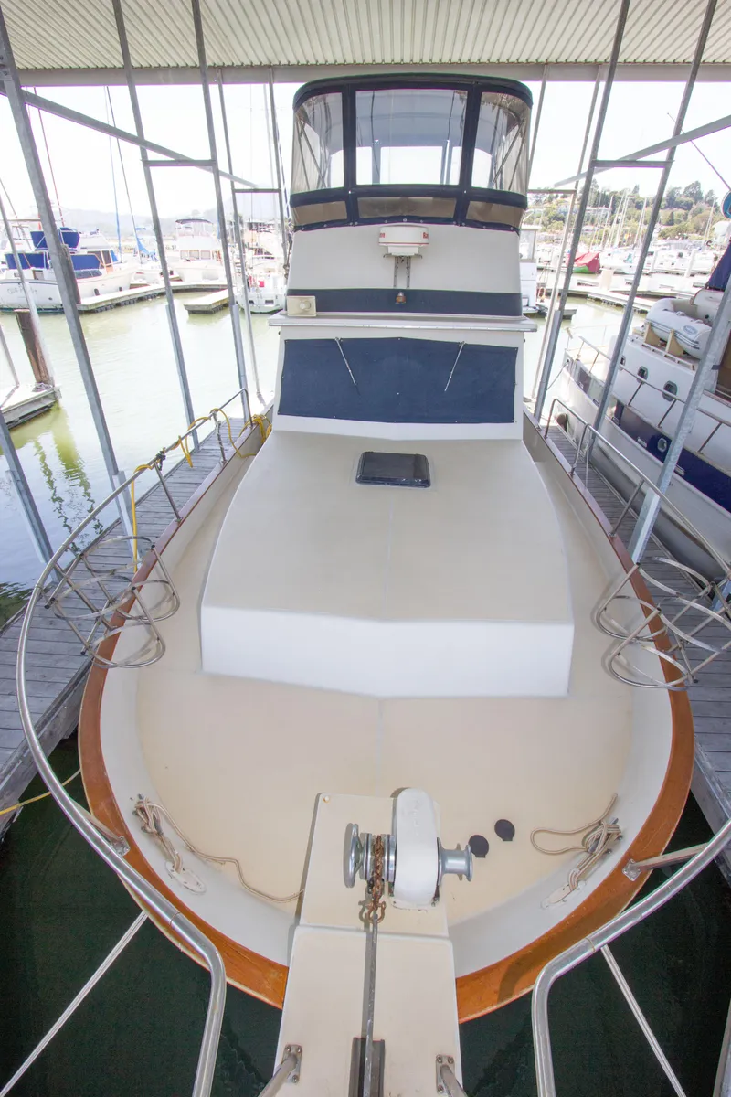 Slide: The Image of 1984 Californian LRC yacht docked, front view. - 26