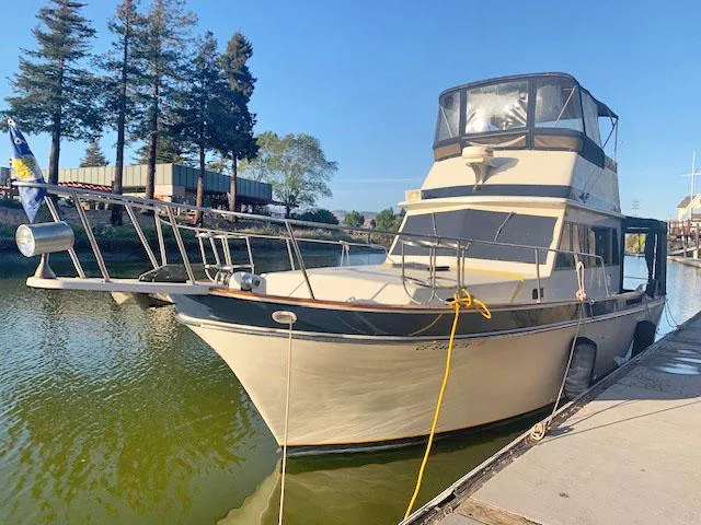 Slide: The Image of 1984 Californian LRC yacht docked on a sunny day. - 3