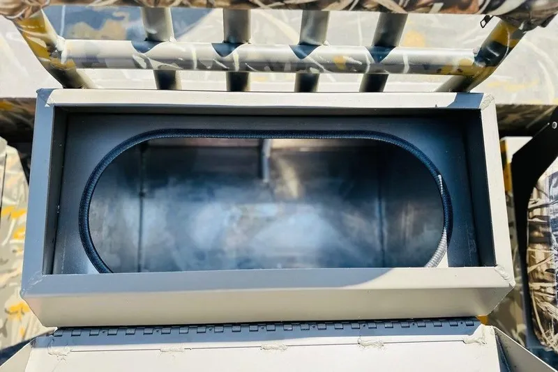 Slide: The Image of Interior view of 2026 War Eagle 961 Blackhawk storage compartment with camouflage accents. - 4