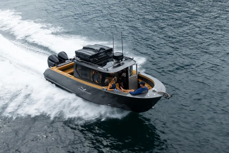 Slide: The Image of Jasper Marine Defender 22, 2026, cruising swiftly on the water. - 5