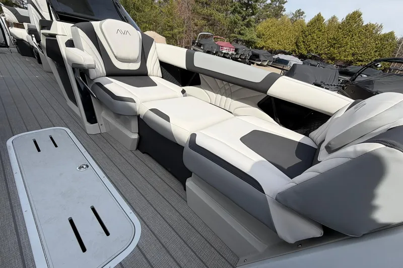 Slide: The Image of Luxurious seating on 2026 Avalon Excalibur Quad Lounge Windshield boat, showcasing modern design and comfort. - 10