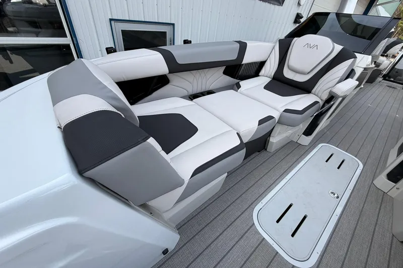 Slide: The Image of Luxurious seating on 2026 Avalon Excalibur Quad Lounge Windshield boat, featuring sleek design and comfort. - 11