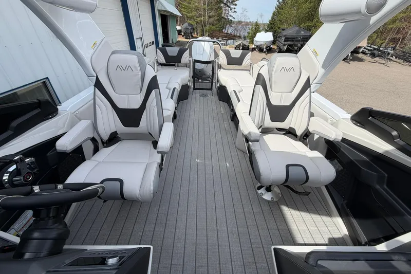 Slide: The Image of 2026 Avalon Excalibur Quad Lounge boat interior with luxurious seating and modern design. - 13