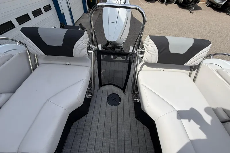 Slide: The Image of 2026 Avalon Excalibur Quad Lounge boat interior with white seating and modern design. - 19