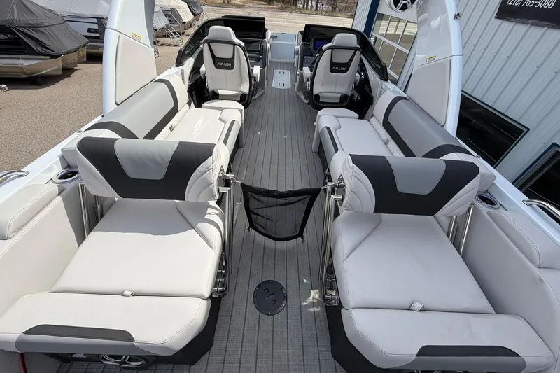 Slide: The Image of 2026 Avalon Excalibur Quad Lounge Windshield boat interior with luxurious seating. - 24