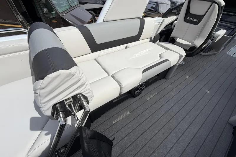 Slide: The Image of 2026 Avalon Excalibur Quad Lounge Windshield boat interior with luxurious seating and modern design. - 26