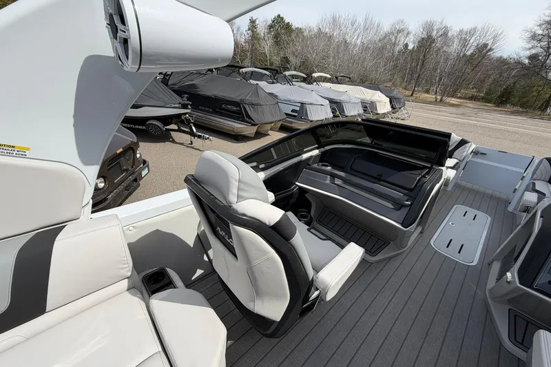 Slide: The Image of 2026 Avalon Excalibur Quad Lounge Windshield boat interior with sleek seating and modern design. - 28