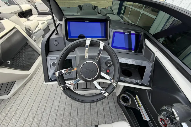 Slide: The Image of Steering console of 2026 Avalon Excalibur Quad Lounge Windshield boat with dual screens. - 31
