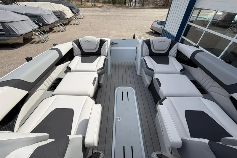 Slide: The Image of Luxurious interior of 2026 Avalon Excalibur Quad Lounge Windshield boat, featuring plush seating. - 33