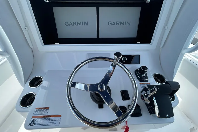 Slide: The Image of Helm of 2026 Contender 39 ST boat with Garmin displays and controls. - 15