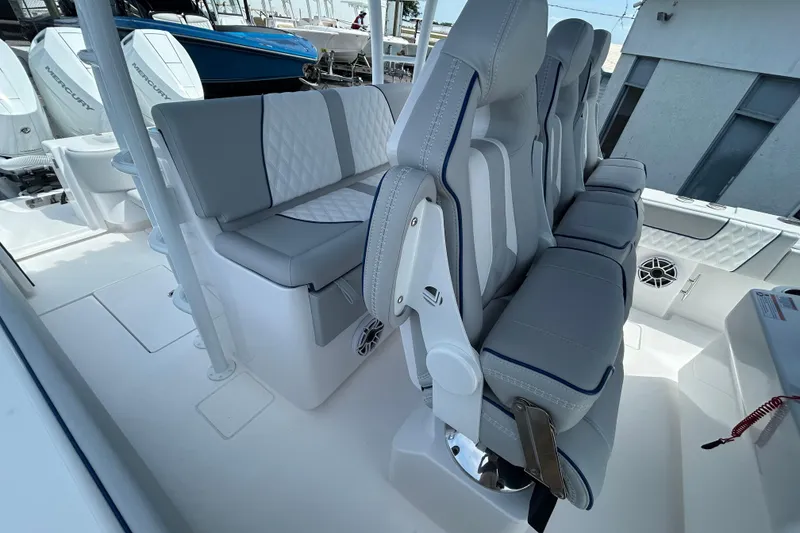Slide: The Image of 2026 Contender 39 ST boat interior with sleek gray seating and modern design. - 17