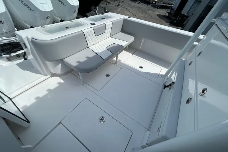 Slide: The Image of 2026 Contender 39 ST boat interior with seating and storage compartments. - 25