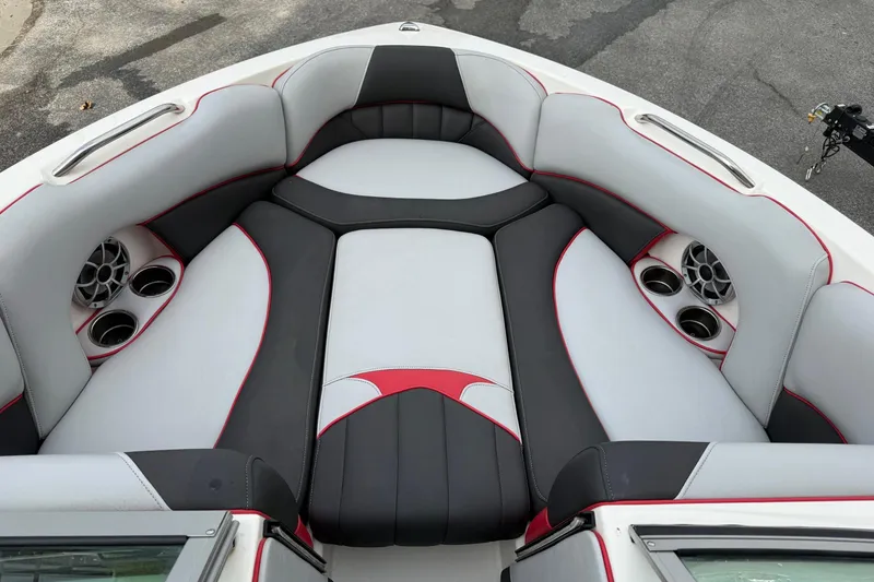 The Image of 2014 MBSPORTS B523 23V boat with red and black accents on a trailer. - 0