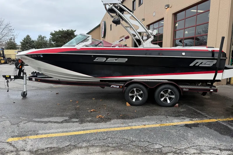 Slide: The Image of 2014 MBSPORTS B523 23V boat on trailer outside a building. - 4