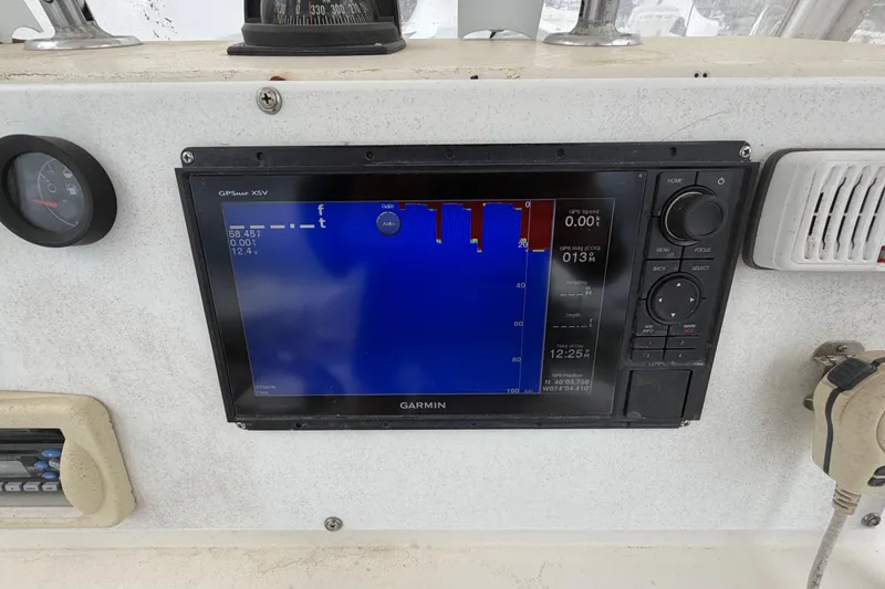 Slide: The Image of Garmin GPS display on 1985 SeaCraft SC 23 Classic boat dashboard. - 20