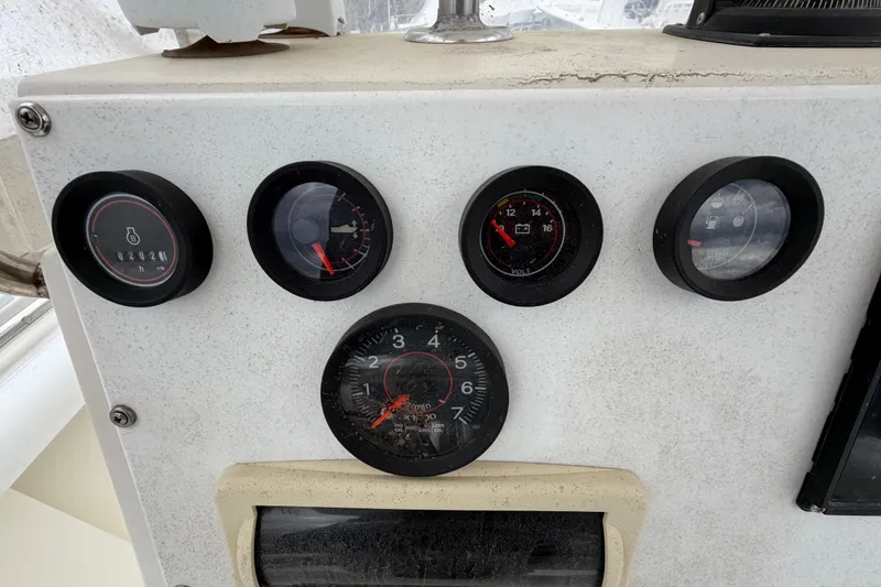 Slide: The Image of Dashboard gauges of a 1985 SeaCraft SC 23 Classic boat. - 23