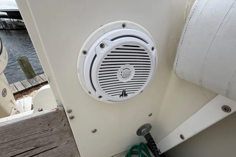 Slide: The Image of White marine speaker on 1985 SeaCraft SC 23 Classic boat, dockside view. - 24