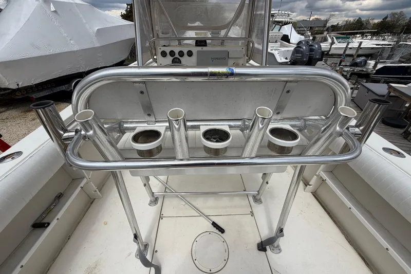Slide: The Image of 1985 SeaCraft SC 23 Classic boat with rod holders and console, docked at marina. - 26