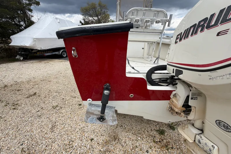 Slide: The Image of 1985 SeaCraft SC 23 Classic boat with Evinrude engine, parked on gravel. - 7