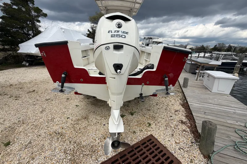 Slide: The Image of 1985 SeaCraft SC 23 Classic boat with Evinrude 250 engine at dockside. - 9