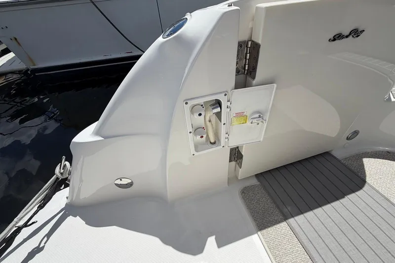 Slide: The Image of 2006 Sea Ray 44 Sedan Bridge yacht deck with open hatch and sleek design. - 15
