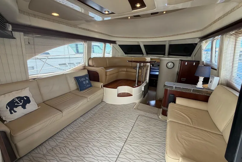 Slide: The Image of Luxurious interior of 2006 Sea Ray 44 Sedan Bridge yacht with beige seating. - 27